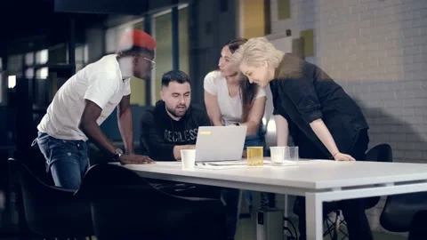 Friendly multinational team of creative young people solve business problems in Stock Footage 140735822