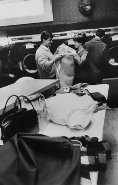 Friendly pair meet over the laundry at ""wash-ateri, Chicago, Illinois, USA Fotos Stock