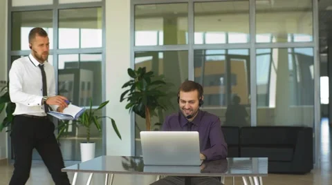 Friendly phone operator. Two male operators and one female Stock Footage 67663969