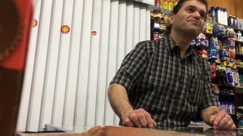 Friendly Small Business Owner Talking to Customer at Checkout Counter Stock Footage 342341349