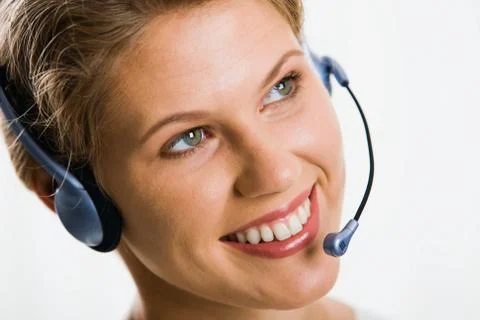 A friendly smiling customer support operator Stock Photos