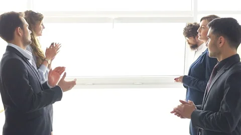 Friendly staff applauds their manager. Win at negotiations. Stock Footage 121377264