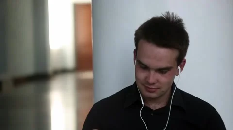 Friendly student is smiling on camera Stockbeeldmateriaal 54267330