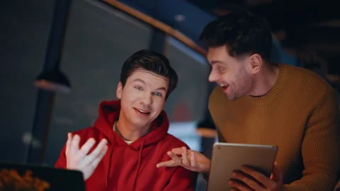 Friendly team enjoying work late evening at coworking closeup. Smiling managers Stock Footage 340113119