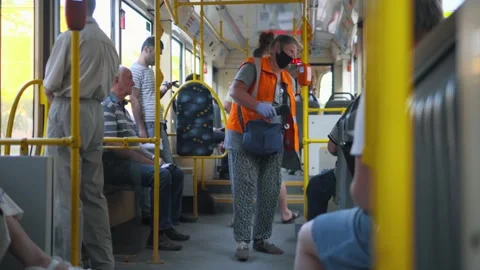 A friendly tram conductor taking care of passengers Stock-Footage 138125468