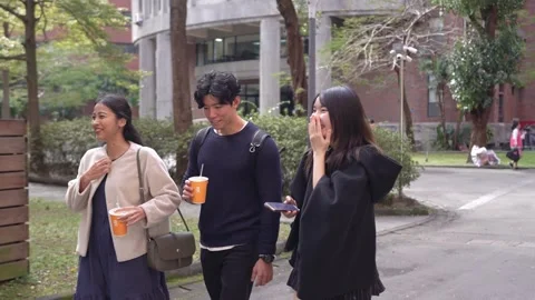 Friendly Walk and Chat on University Campus in Da’an District, Taipei Stock Footage 281080033