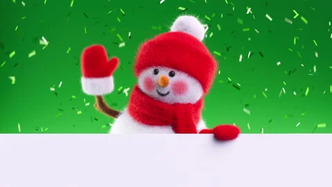 Friendly wool felt snowman rises from below a white surface Stock Footage 318421049