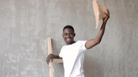 Friendly Young African-American Guy greets by taking off his hat. Stock Footage 203973067