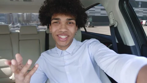 Friendly young afro man with pierced nose well dressed waving his hand to say hi Stock Footage 154040052