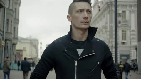 Friendly young trendy man walking around the urban city having fun Video stock 61799451