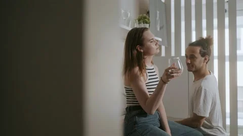 Friends in apartment talks in kitchen. Video stock 158159287