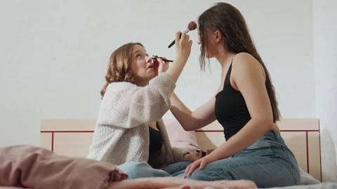Friends Applying Makeup, Relaxed Friends Enhance Their Smiles With Cosmetics Stock Footage 330802828