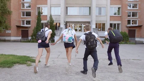 Friends Are Going to School. They Have A Lot of Fun Because Today is Their First Stock-Footage 94328964