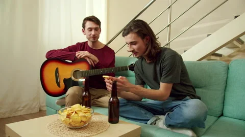 Friends are looking for chords and songs on the Internet Stock Footage 159348742