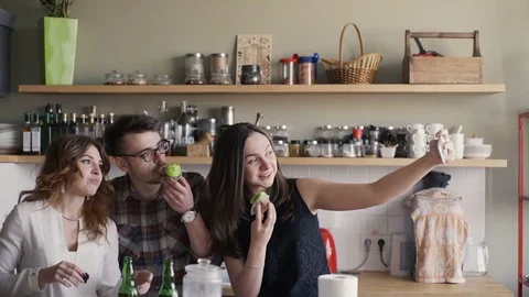 Friends are taking selfie in a kitchen party Stock Footage 73586996