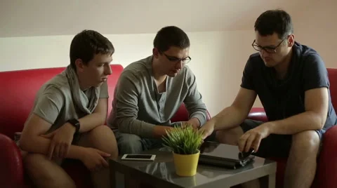 Friends are using a tablet in their conversation Stock Footage 65047064