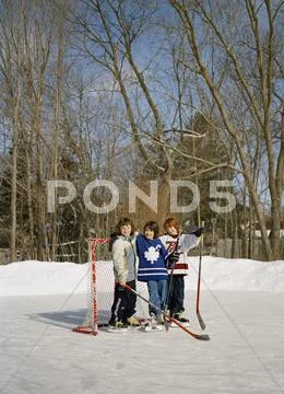 Friends On Backyard Hockey Rink