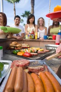 Friends At Barbecue Stock Photos