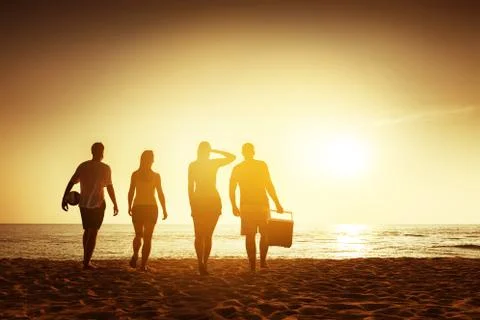 Friends beach sunset concept with stuff Stock Photos