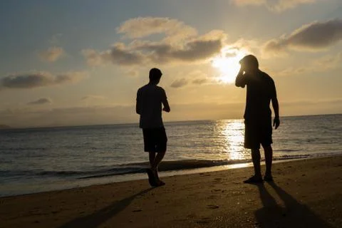 Friends at the beach for sunset Stock Photos