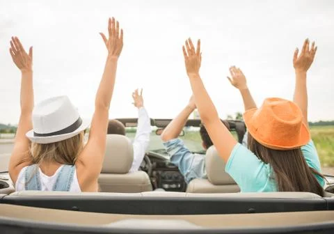 Friends in cabriolet Stock Photos