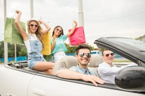 Friends in cabriolet Stock Photos