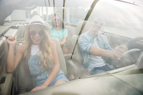 Friends in cabriolet Stock Photos
