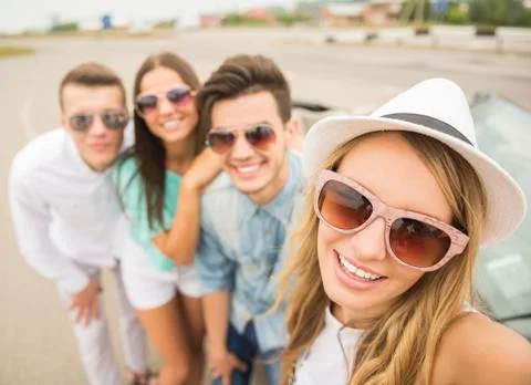 Friends in cabriolet Stock Photos