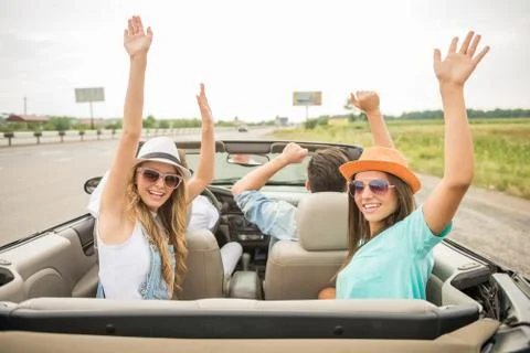 Friends in cabriolet Stock Photos