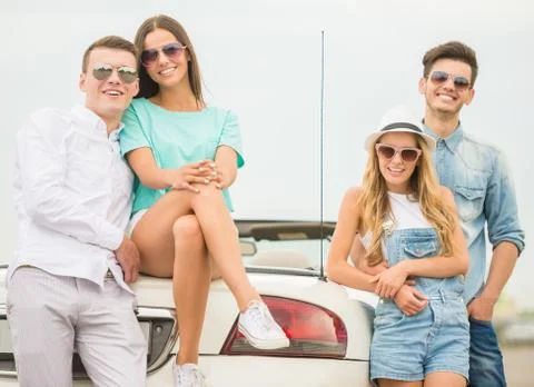 Friends in cabriolet Stock Photos
