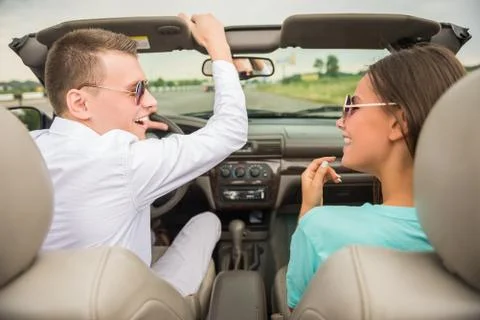 Friends in cabriolet Stock Photos