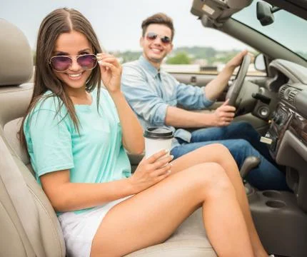 Friends in cabriolet Stock Photos