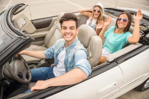 Friends in cabriolet Stock Photos