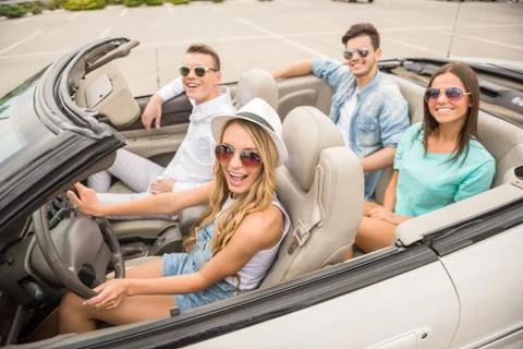 Friends in cabriolet Stock Photos