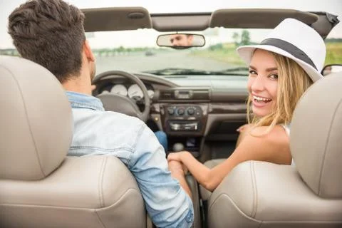 Friends in cabriolet Stock Photos