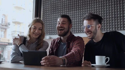 Friends at the cafe laughing while video chatting Video stock 106093304