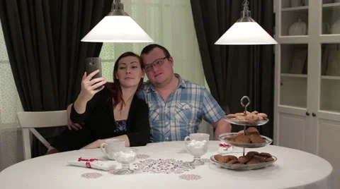 Friends in cafe sitting at the table doing selfie Video stock 62799279