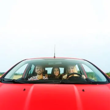 Friends in a car. Stock Photos
