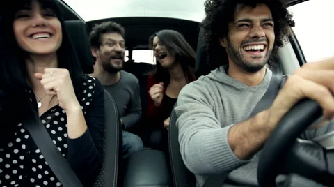 Friends in car singing and dancing like crazy Stock Footage