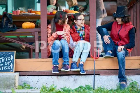 Friends chatting at Halloween party Stock Photos