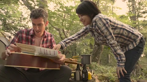 Friends checking map at a camp site, Yamanashi Prefecture Video stock 58466490