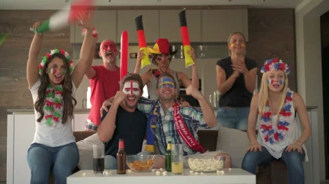 Friends cheering teams of different countries Stock Footage 63500227