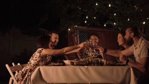 Friends clinking glasses of wine Stock Footage