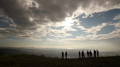 Friends on a cloudy day on the edge of a slope Видео 49895262