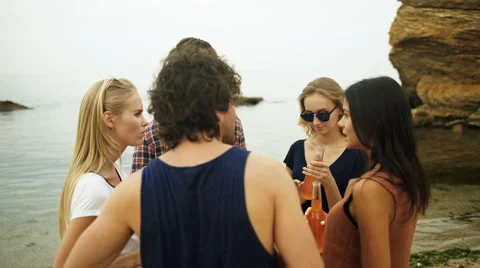 Friends communicating on the beach Stock Footage 68796397