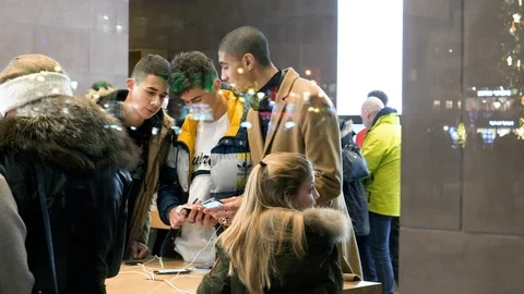 Friends comparing Android and iOS looking at latest iPhone 11 Pro Stock Footage 119965290