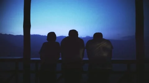 Friends contemplating mountain landscape Stock Footage 59732768