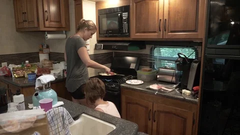 Friends Cooking Breakfast in 5th Wheel Camper Kitche Stock Footage 80617902