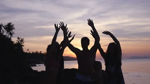 Friends dance at sunset with their hands up. slow motion, 1920x1080, full hd Stock Footage 89163330