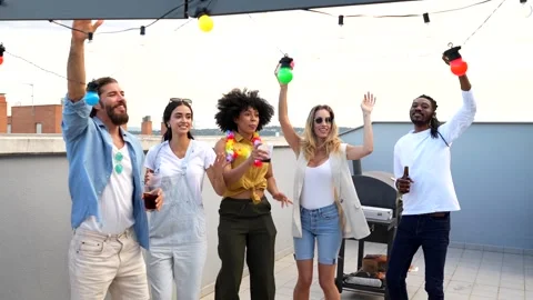 Friends dancing and enjoying rooftop party Stock Footage 311800949